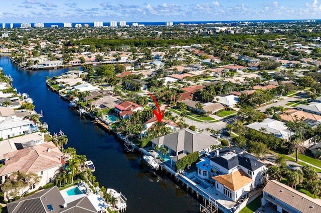 birds eye view of property featuring a residential view and a water view