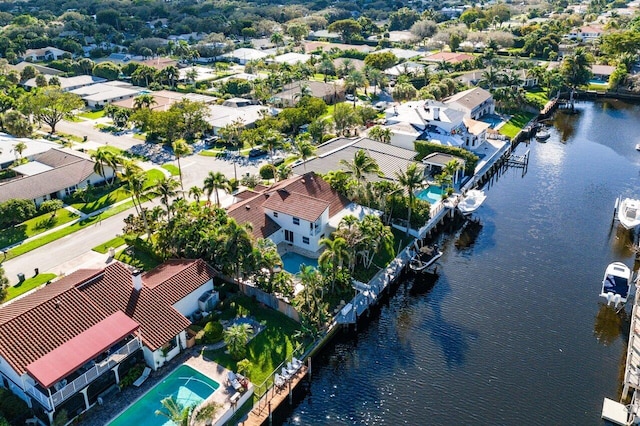 birds eye view of property with a residential view and a water view
