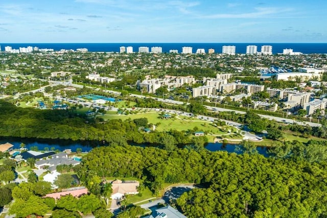 drone / aerial view featuring a water view and a city view