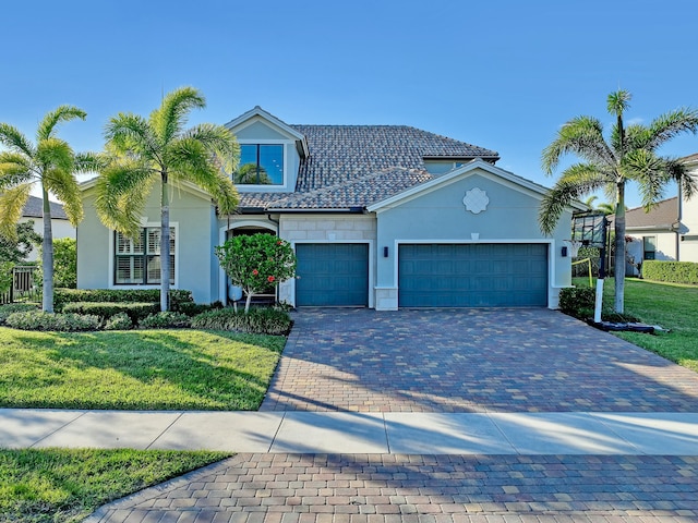 view of front facade featuring a garage and a front lawn