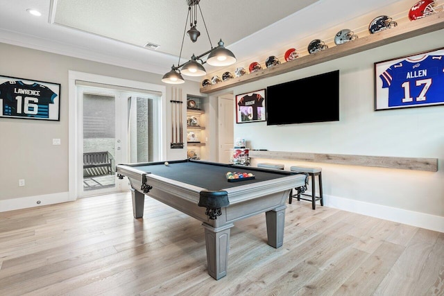 playroom with french doors, baseboards, light wood-style floors, and crown molding