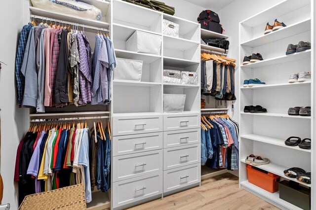 spacious closet with light wood-style flooring