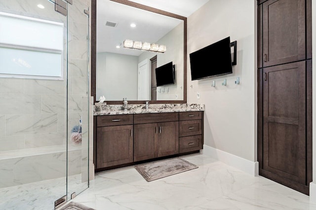 full bathroom with vanity, visible vents, a marble finish shower, baseboards, and marble finish floor