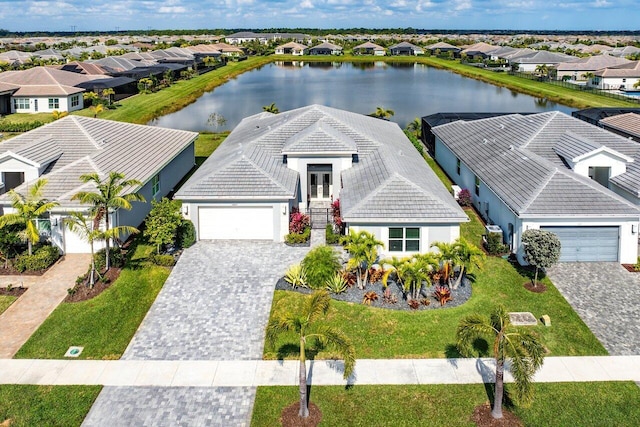 bird's eye view with a residential view and a water view