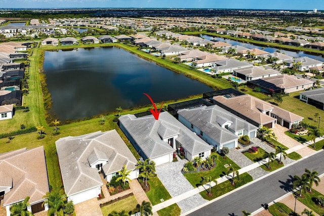 aerial view featuring a residential view and a water view