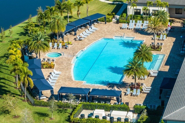 view of swimming pool with fence