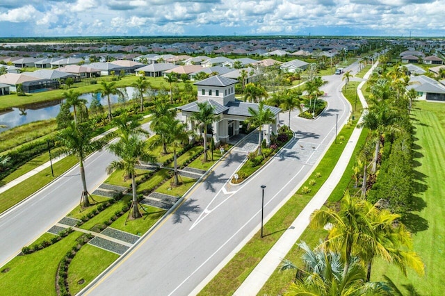 aerial view featuring a residential view and a water view