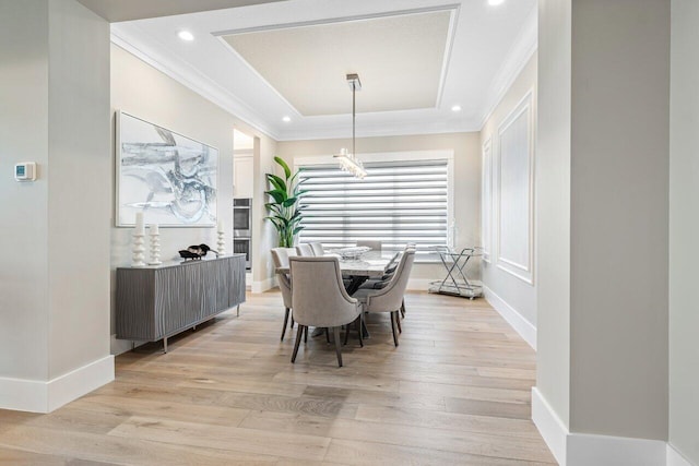 dining room with light wood finished floors, recessed lighting, baseboards, and ornamental molding