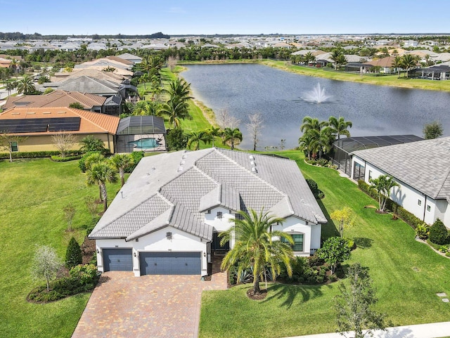 bird's eye view with a water view and a residential view