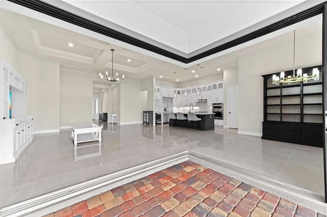 unfurnished dining area with baseboards, a notable chandelier, and recessed lighting