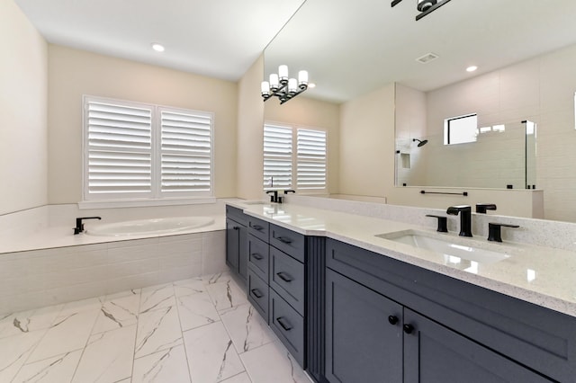 full bathroom featuring marble finish floor, double vanity, a sink, walk in shower, and a bath