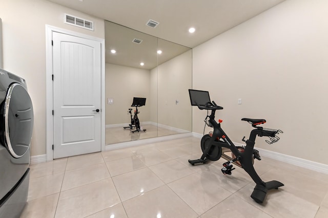 exercise room with recessed lighting, washer / clothes dryer, visible vents, and light tile patterned floors