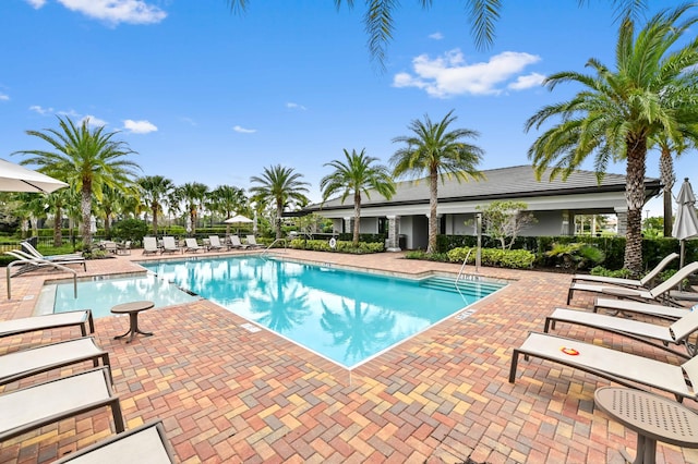 community pool featuring a patio area