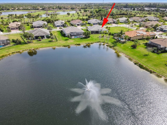 bird's eye view with a water view and a residential view