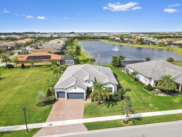 birds eye view of property featuring a residential view and a water view