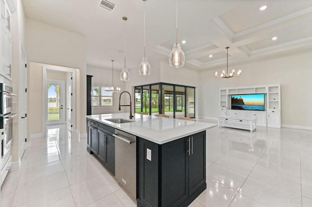 kitchen with appliances with stainless steel finishes, coffered ceiling, a sink, a chandelier, and dark cabinetry