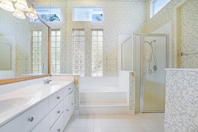 full bath featuring a stall shower, a garden tub, and wallpapered walls