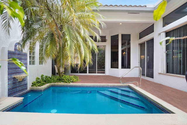 outdoor pool with a patio