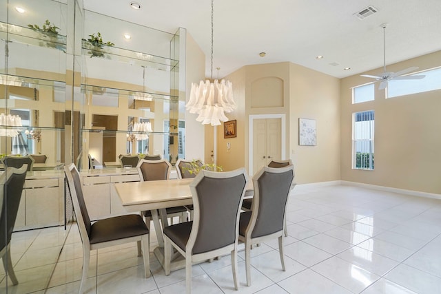 dining room with light tile patterned floors, baseboards, visible vents, and ceiling fan with notable chandelier