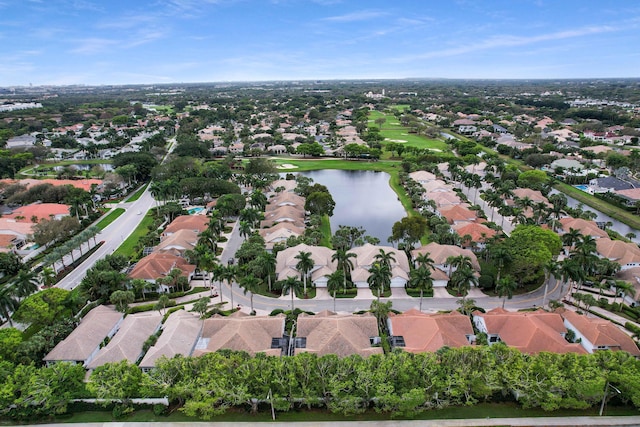 drone / aerial view with a water view and a residential view