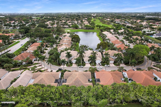 drone / aerial view with a water view and a residential view