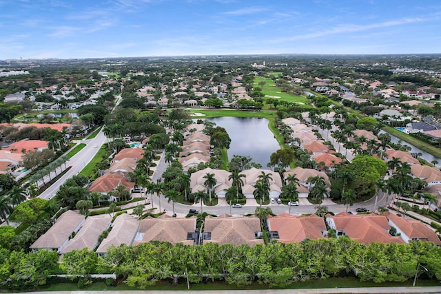 drone / aerial view with a residential view and a water view