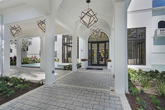 view of exterior entry featuring french doors