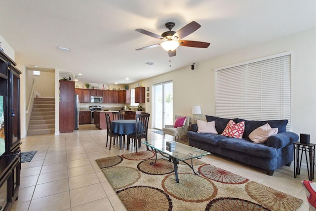 tiled living room featuring ceiling fan