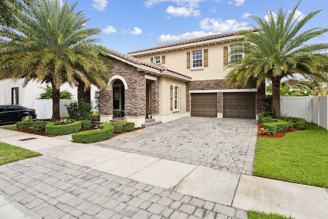 mediterranean / spanish-style house featuring a garage