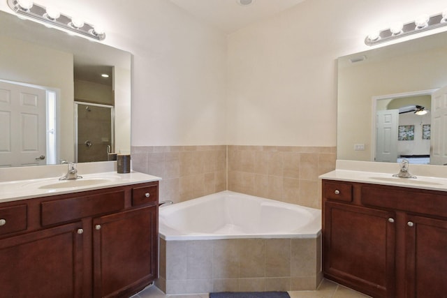 bathroom with vanity, tile patterned flooring, shower with separate bathtub, and ceiling fan