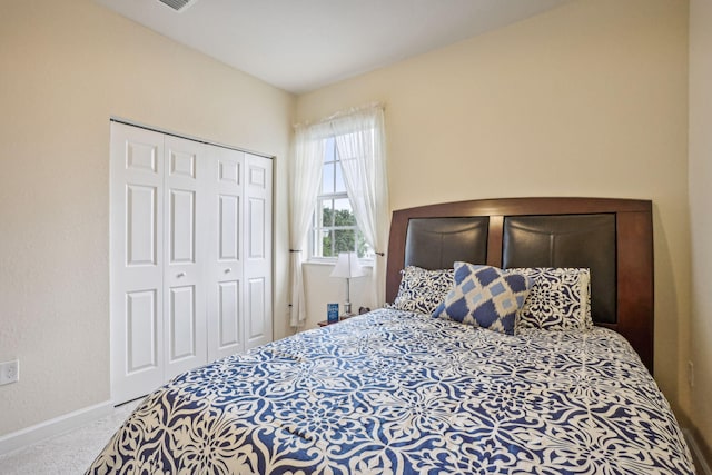 carpeted bedroom featuring a closet