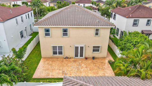 rear view of house featuring a patio