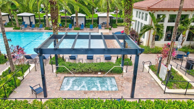 view of pool featuring a pergola and a community hot tub