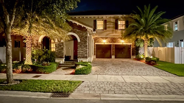 mediterranean / spanish-style home featuring a garage