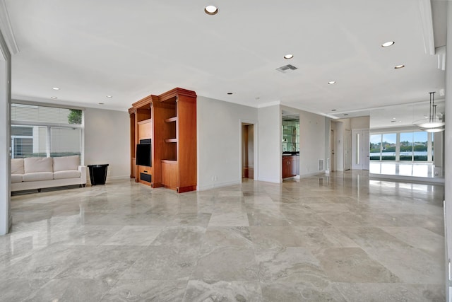 unfurnished living room featuring crown molding