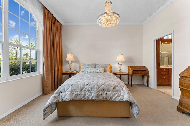 bedroom featuring crown molding, connected bathroom, light carpet, and an inviting chandelier