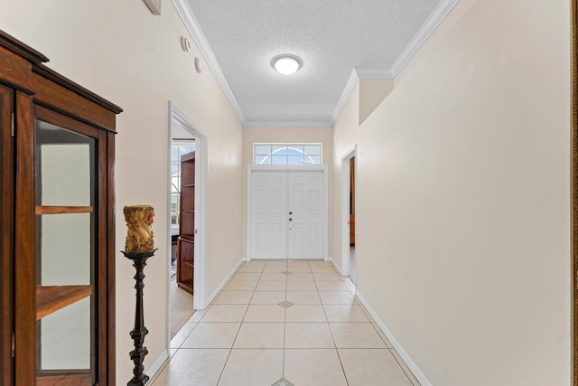 entryway with crown molding, a textured ceiling, and light tile patterned flooring