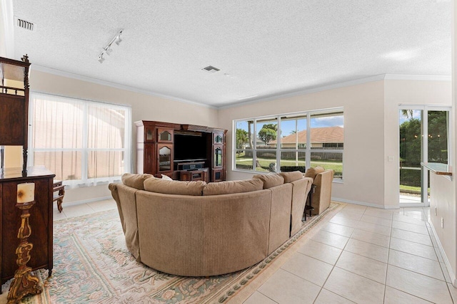 living area with a textured ceiling, visible vents, crown molding, and light tile patterned flooring