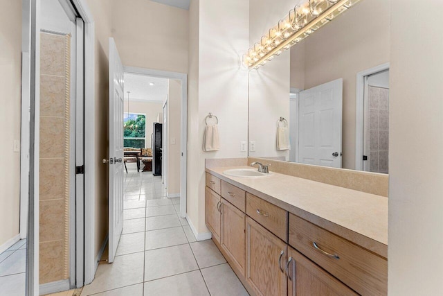 bathroom with tile patterned flooring and vanity