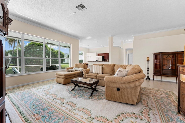 tiled living room with ornamental molding, visible vents, and a textured ceiling