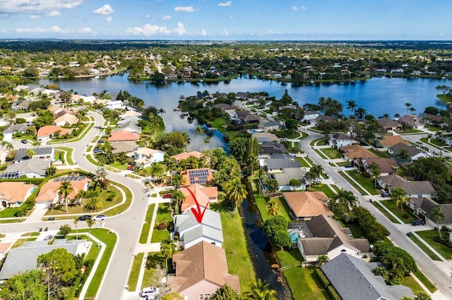 bird's eye view with a water view