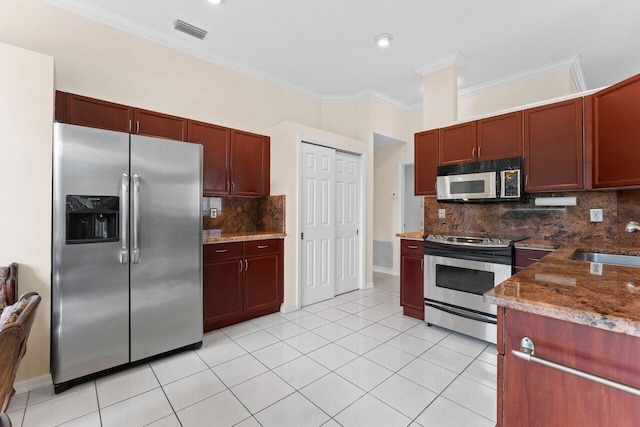 kitchen with ornamental molding, stainless steel appliances, sink, and light tile patterned floors