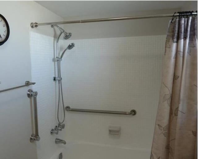 bathroom with shower / bath combo