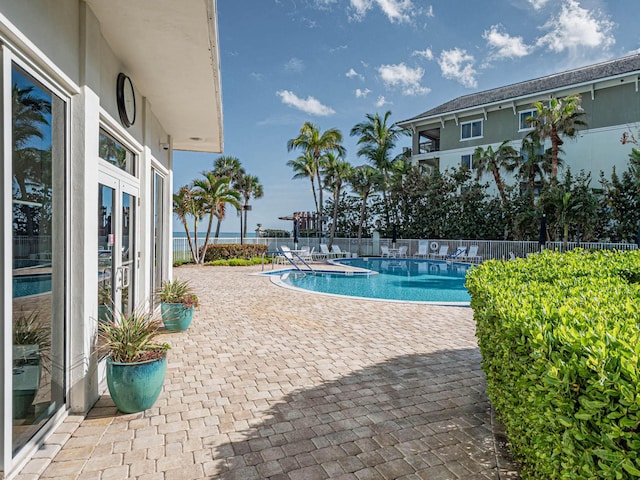 3554 Ocean Dr Unit Ph4S, Vero Beach, FL 32963 - community pool with a patio area, french doors, and fence