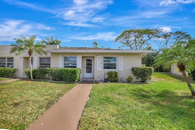 20835 Wendall Ter Unit 68, Boca Raton, FL 33433 - view of front facade with stucco siding and a front lawn