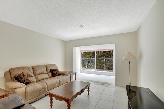 20835 Wendall Ter Unit 68, Boca Raton, FL 33433 - living area featuring a textured ceiling and light tile patterned floors