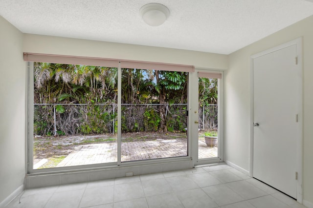 interior space featuring a healthy amount of sunlight and a textured ceiling