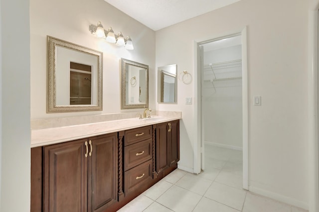 bathroom with vanity and tile patterned floors