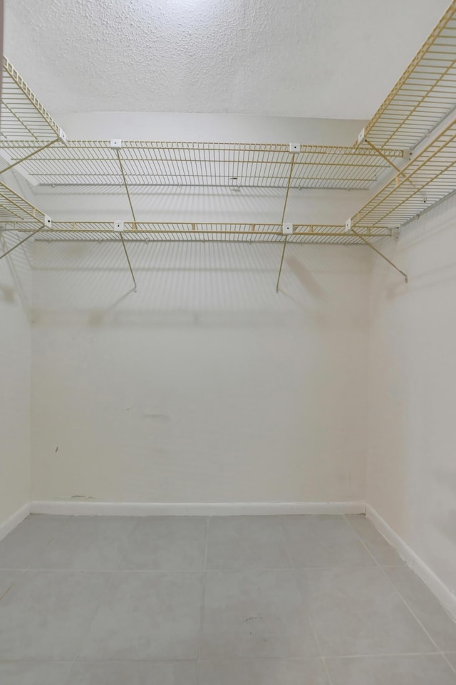 20835 Wendall Ter Unit 68, Boca Raton, FL 33433 - walk in closet featuring light tile patterned floors