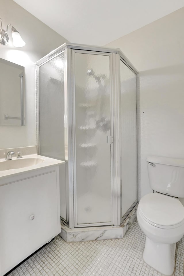 20835 Wendall Ter Unit 68, Boca Raton, FL 33433 - full bathroom with a shower stall, toilet, vanity, and tile patterned floors